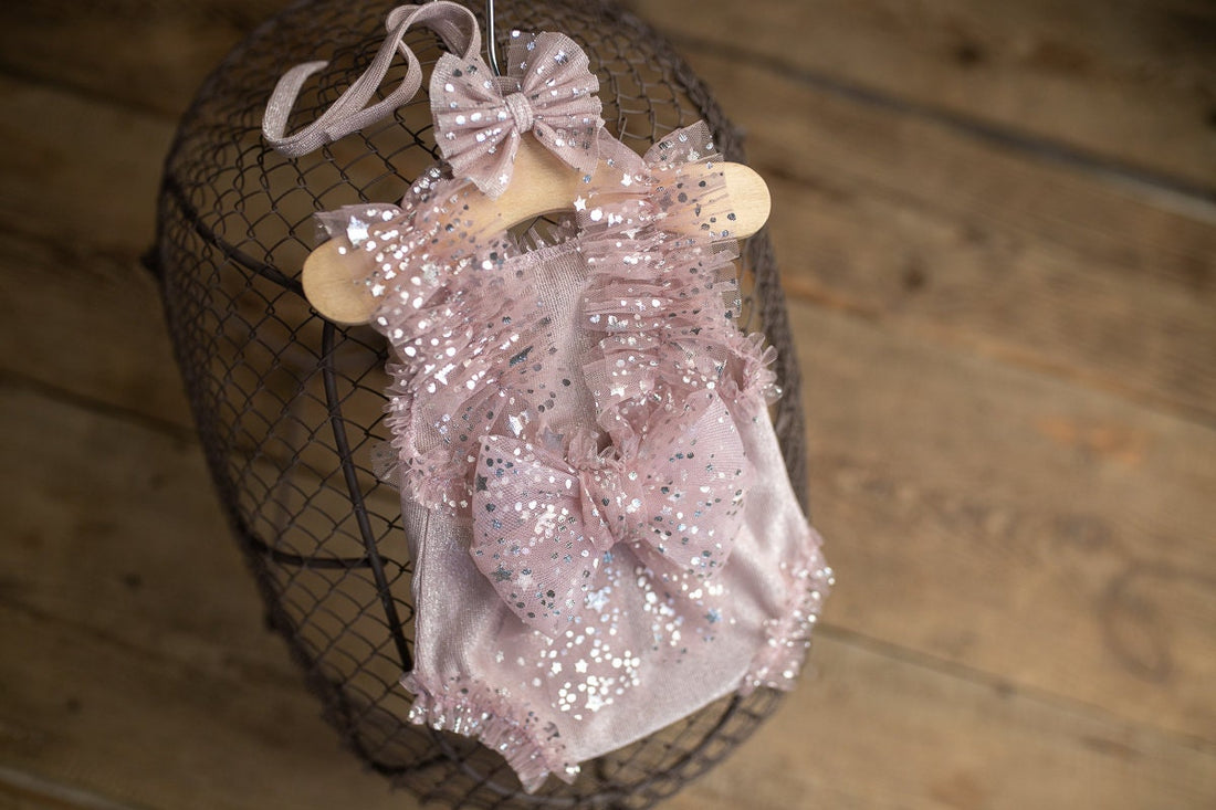 Newborn photography prop styling by mood — lace romper and soft wrap for dreamy photoshoot