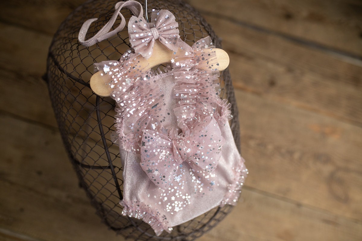 Newborn photography prop styling by mood — lace romper and soft wrap for dreamy photoshoot