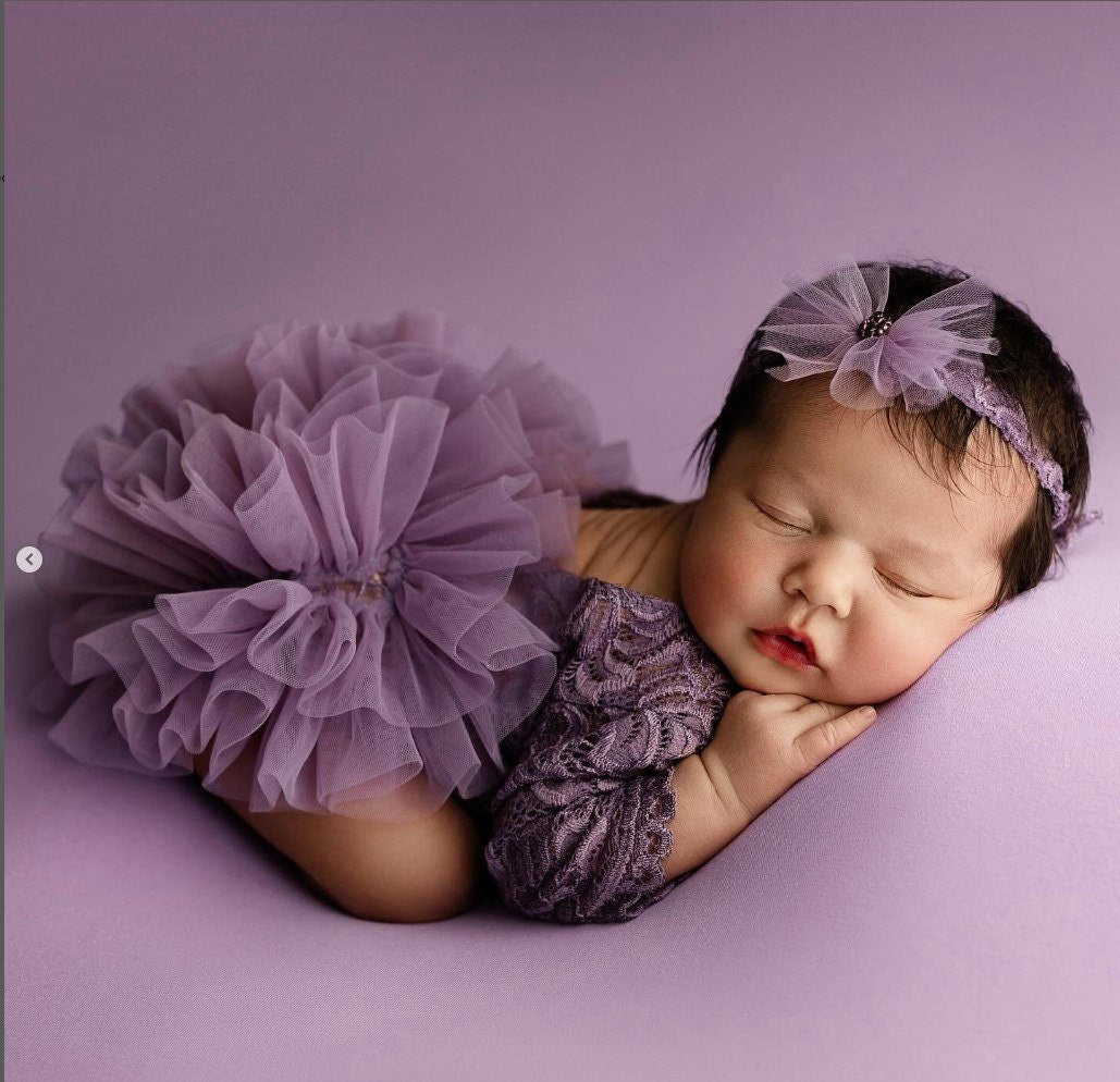 Purple lace newborn romper — color palette inspiration for newborn photoshoots
