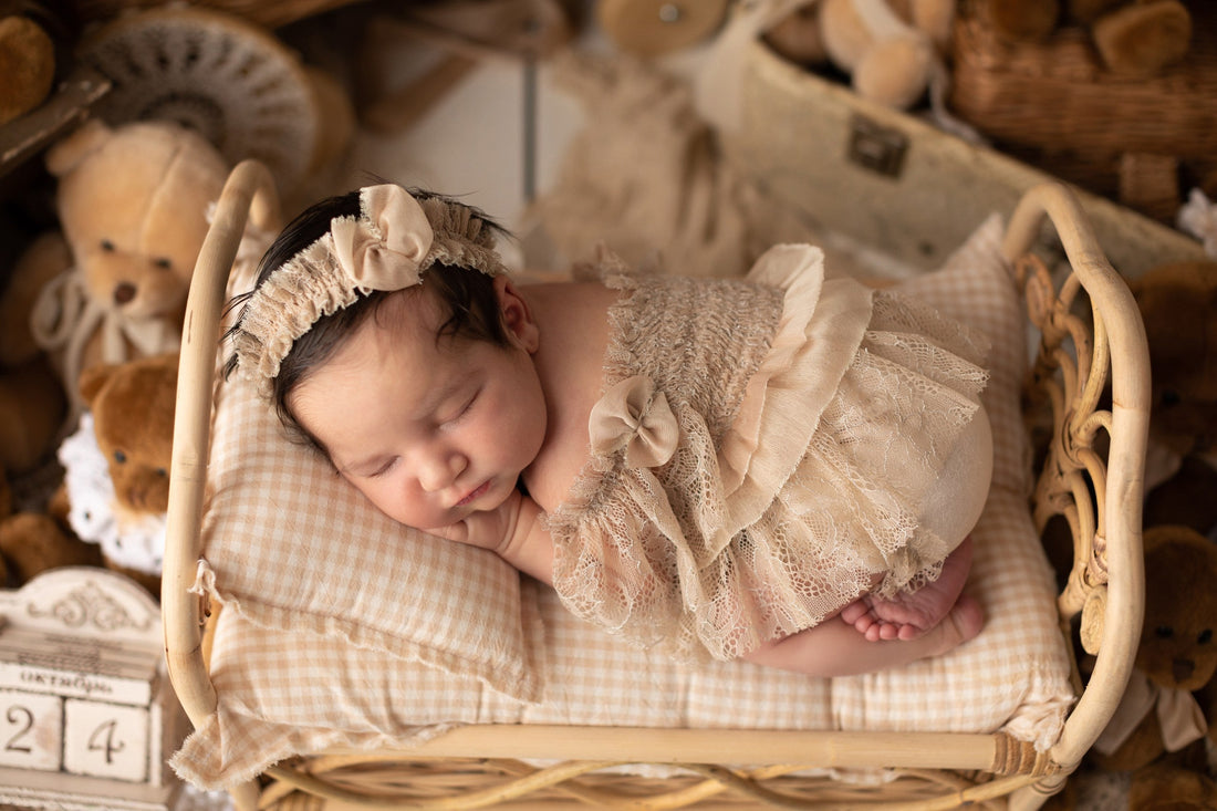 Newborn baby during a professional photo session with handcrafted props