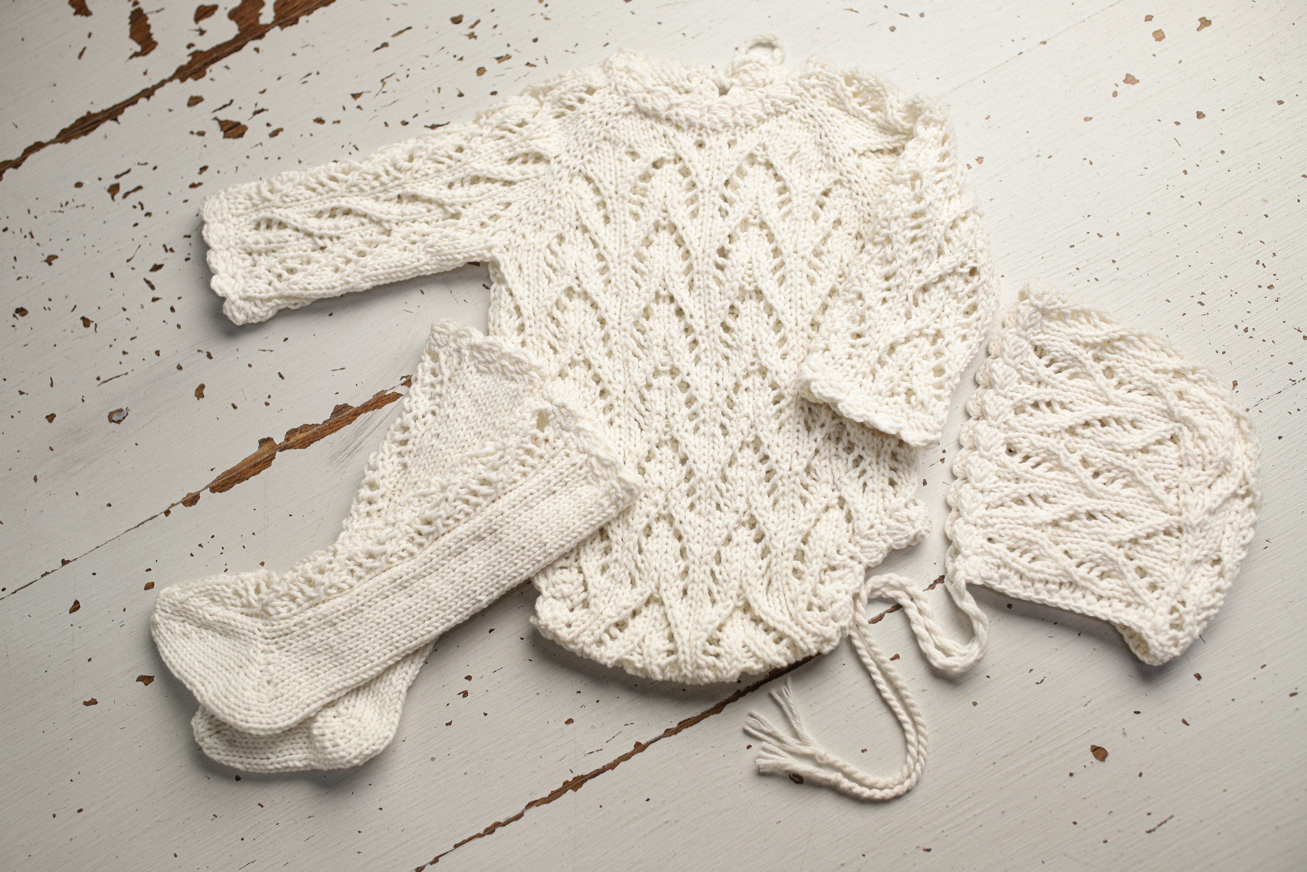 Knitted set for a newborn: jumpsuit, bonnet and socks, clothes for a newborn photo shoot, a gift for a party in honor of the future baby, clothes for discharge from the hospital.