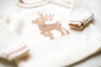 Knitted sweater with a deer pattern on a light background