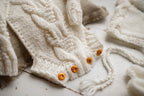 Knitted jumpsuit, bonnet and booties for a newborn, merino wool clothing set, newborn photo shoot props, newborn photo shoot clothes, hospital discharge clothes.